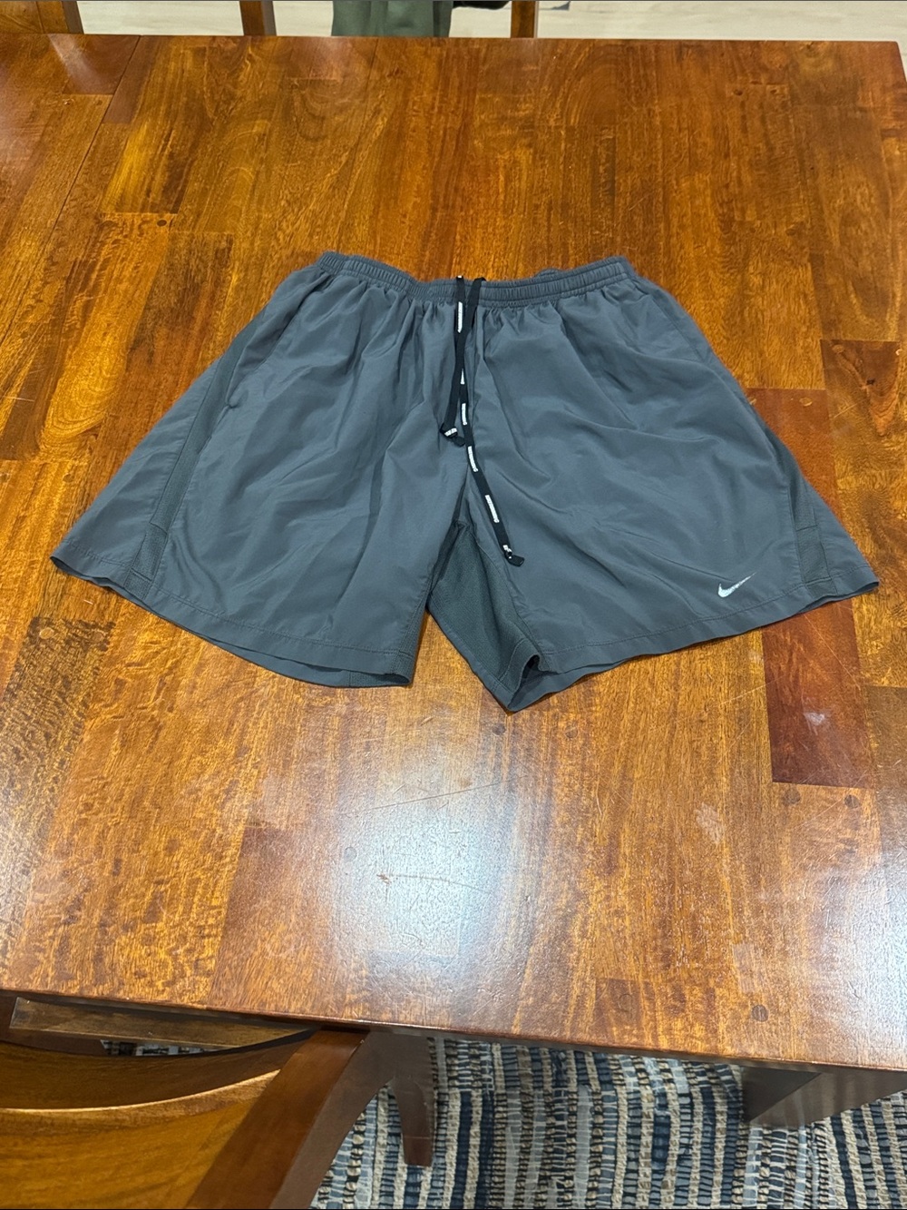 Nike Men's Dark Gray Athletic Running Shorts with Drawstring.